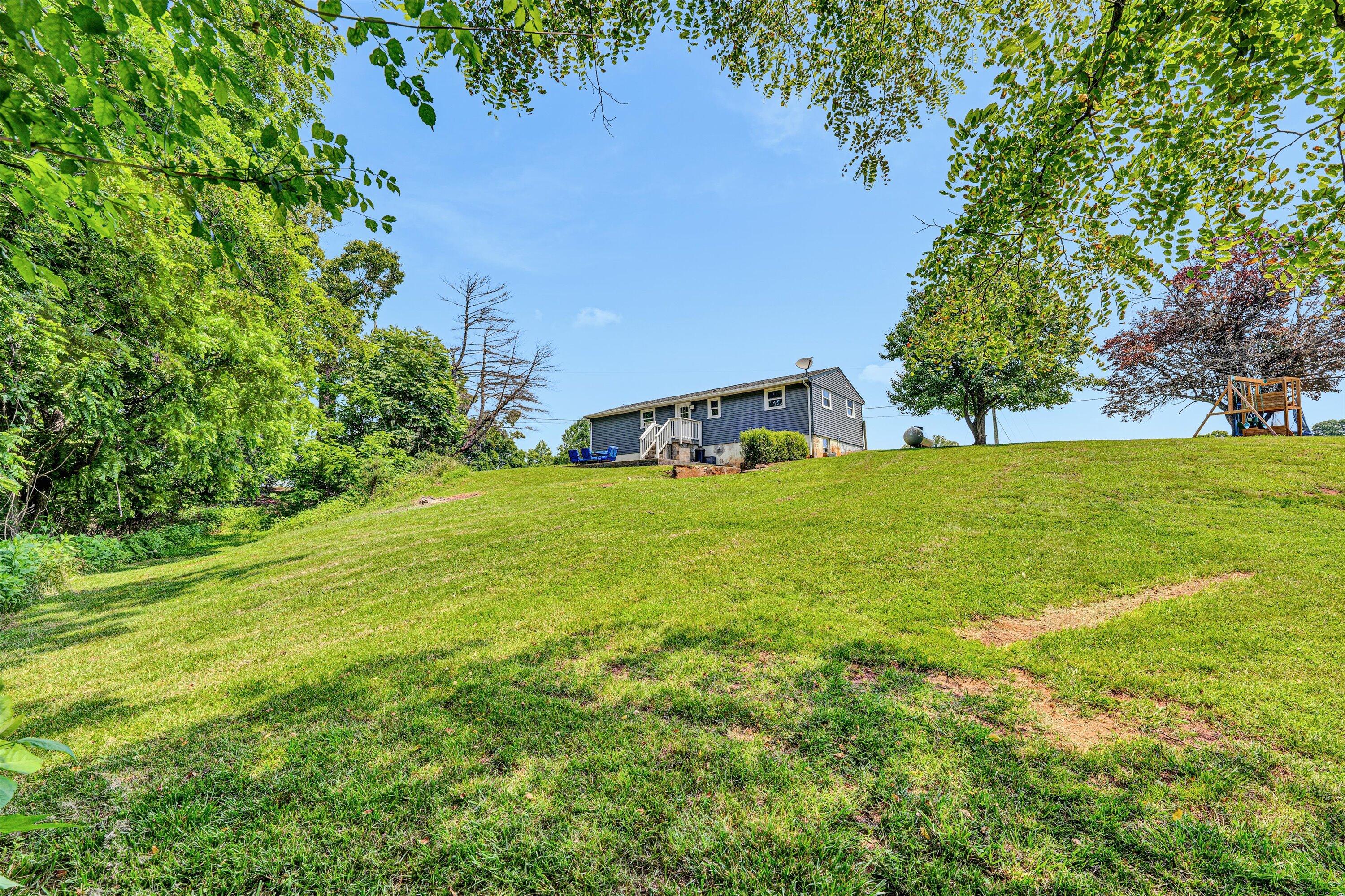1200 Rock Spring Road Goodview, VA 24095 - Photo 31 of 31 a view of a field of grass and trees