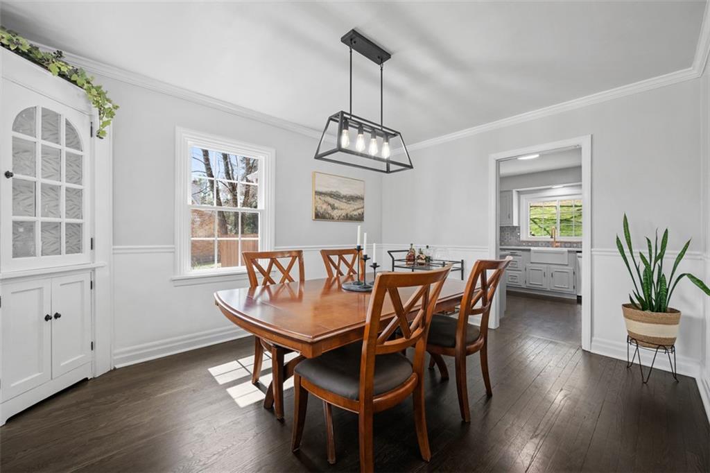 106 Sycamore Drive Pittsburgh, PA 15237 - Photo 11 of 41 a dining room with wooden floor a chandelier a wooden table and chairs