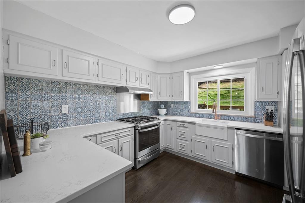 106 Sycamore Drive Pittsburgh, PA 15237 - Photo 13 of 41 a kitchen with granite countertop white cabinets and white appliances
