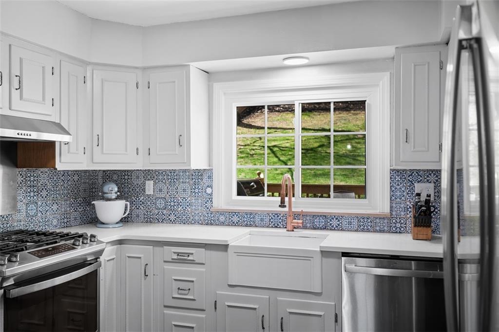 106 Sycamore Drive Pittsburgh, PA 15237 - Photo 14 of 41 a kitchen with appliances cabinets and a window