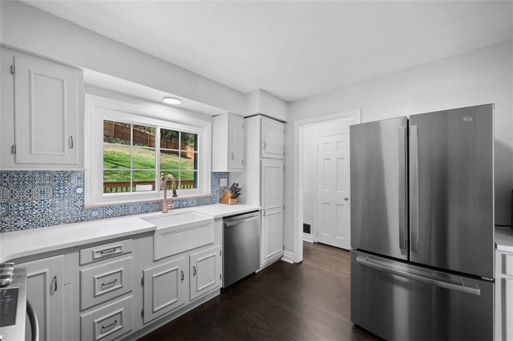 106 Sycamore Drive Pittsburgh, PA 15237 - Photo 15 of 41 a kitchen with stainless steel appliances a refrigerator sink and cabinets