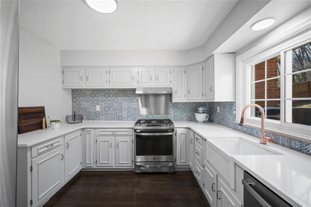 106 Sycamore Drive Pittsburgh, PA 15237 - Photo 16 of 41 a kitchen with a sink stove and cabinets