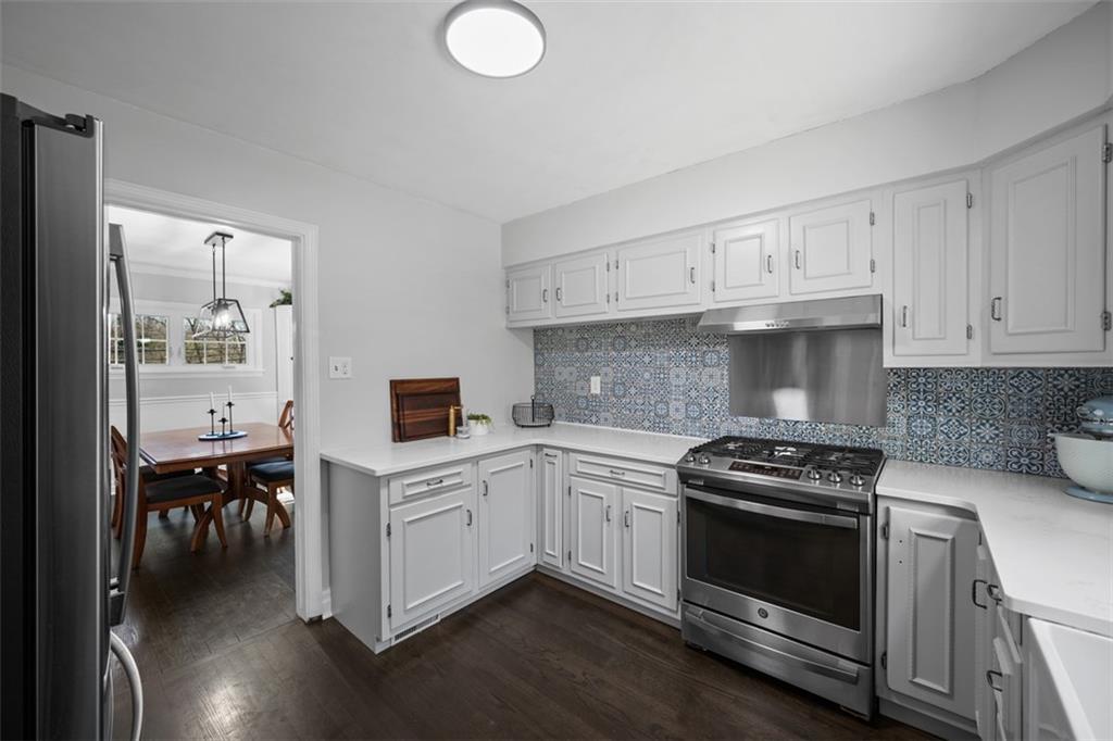 106 Sycamore Drive Pittsburgh, PA 15237 - Photo 17 of 41 a kitchen with cabinets stainless steel appliances and wooden floor