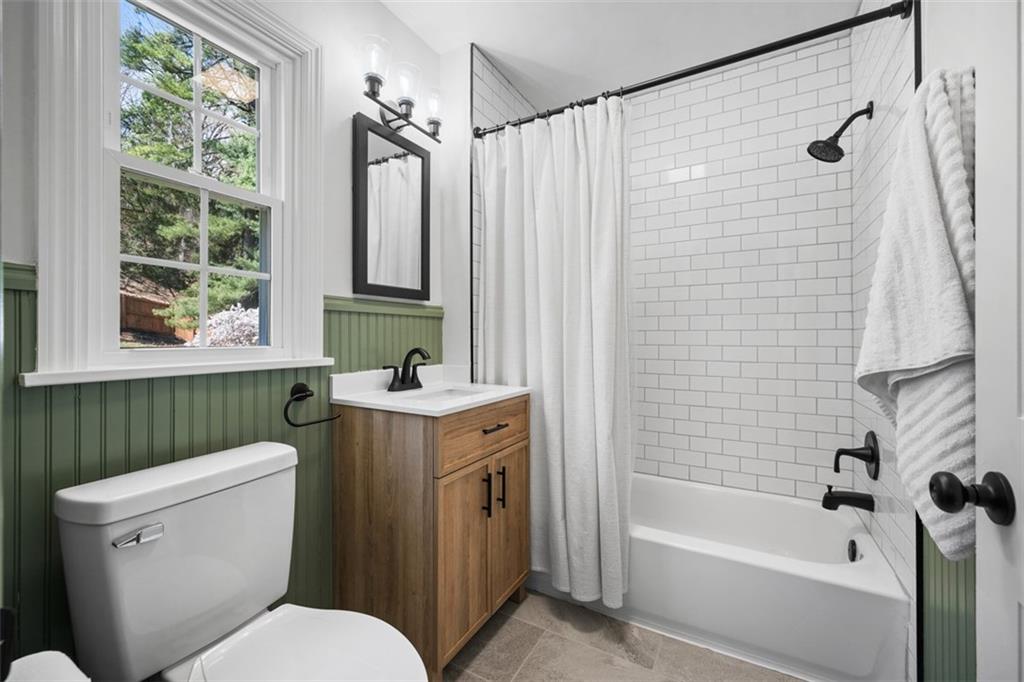 106 Sycamore Drive Pittsburgh, PA 15237 - Photo 25 of 41 a bathroom with a sink a toilet a mirror a bathtub and shower