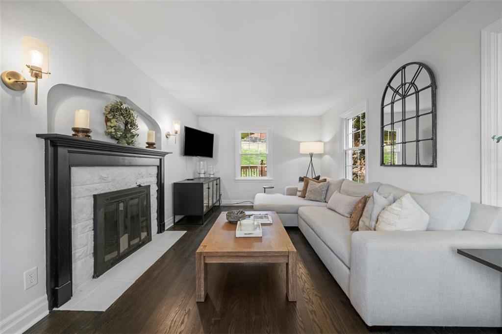 106 Sycamore Drive Pittsburgh, PA 15237 - Photo 6 of 41 a living room with furniture a fireplace and a flat screen tv