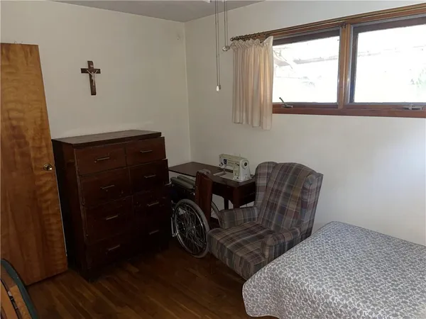 a room with a chair and a window