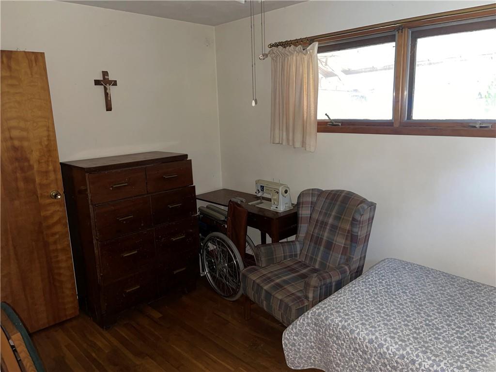 38 3rd Street Scottdale, PA 15683 - Photo 11 of 17 a room with a chair and a window