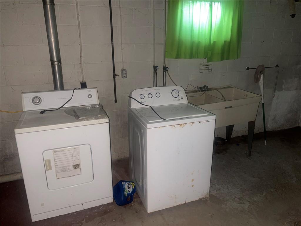 38 3rd Street Scottdale, PA 15683 - Photo 16 of 17 a utility room with dryer and washer