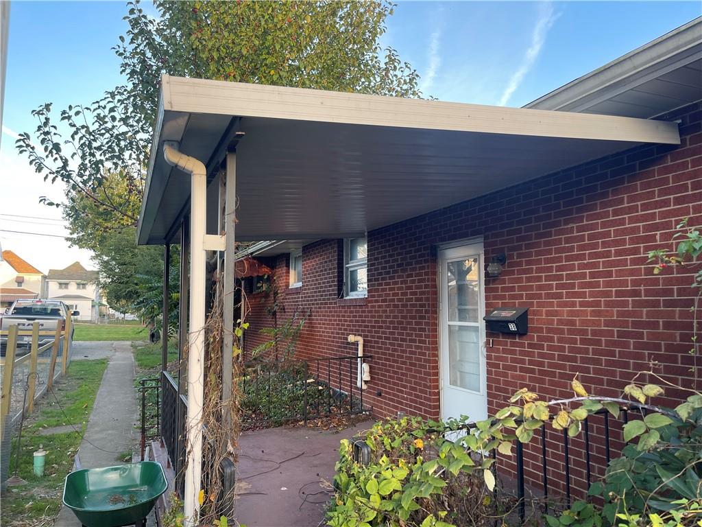 38 3rd Street Scottdale, PA 15683 - Photo 2 of 17 a front view of a house with garden