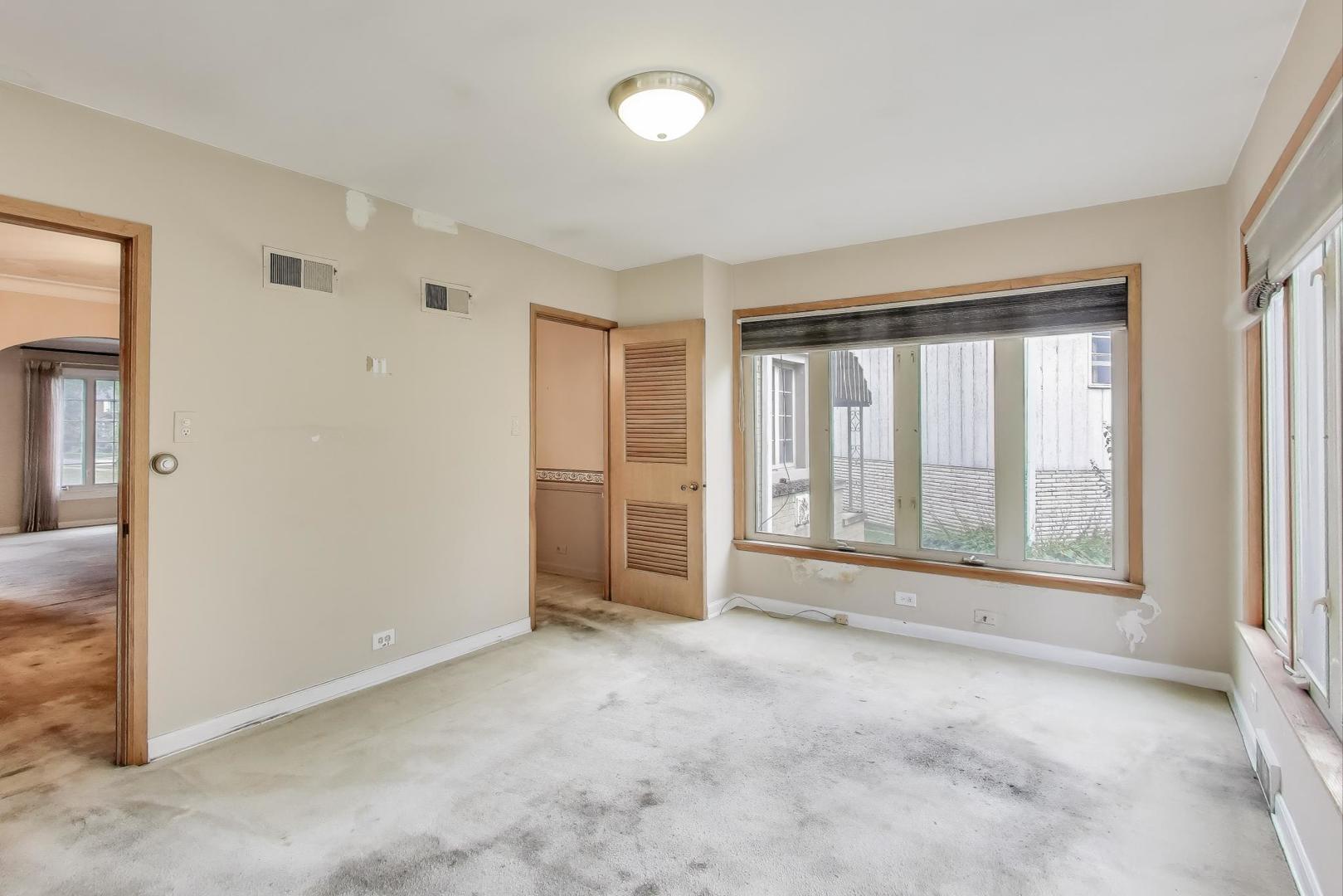601 Selborne Road Riverside, IL 60546 - Photo 17 of 56 an empty room with a empty space and windows