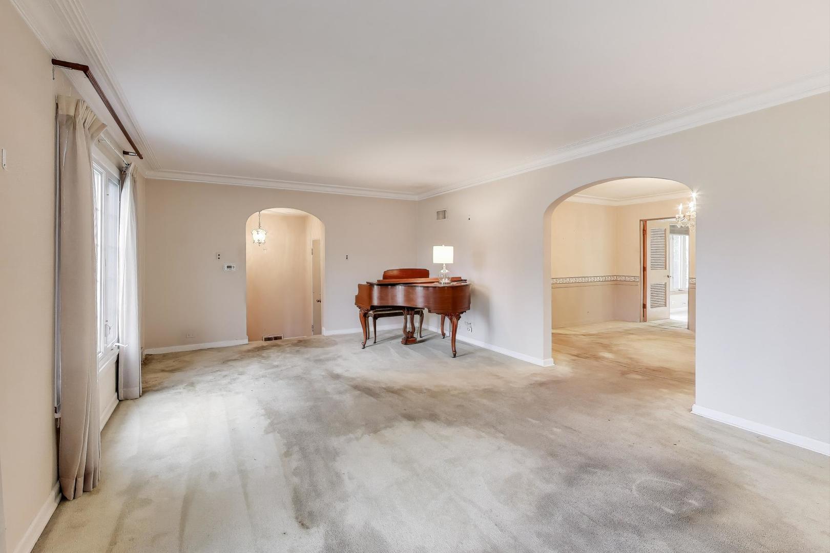 601 Selborne Road Riverside, IL 60546 - Photo 6 of 56 a view of a livingroom with a staircase