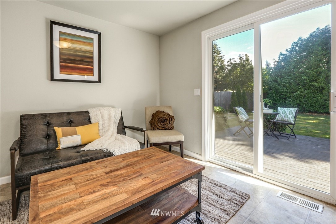 22703 2nd Place West Bothell, WA 98021 - Photo 14 of 23 a bedroom with a bed and wooden floor