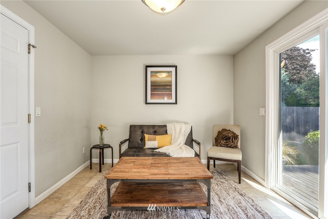 22703 2nd Place West Bothell, WA 98021 - Photo 15 of 23 a bedroom with a bed a rug and a window