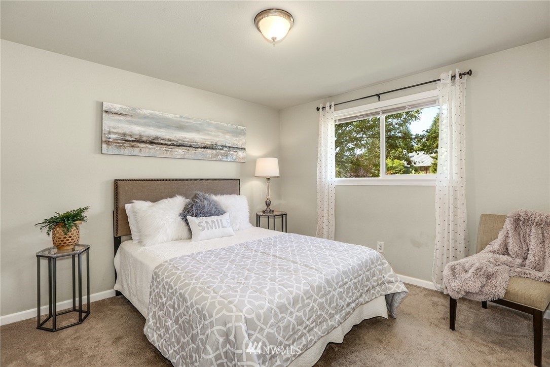22703 2nd Place West Bothell, WA 98021 - Photo 16 of 23 a bedroom with a bed and window