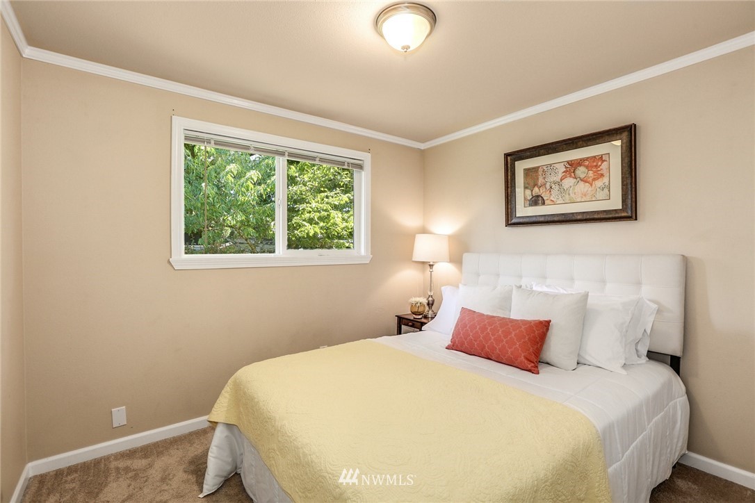 22703 2nd Place West Bothell, WA 98021 - Photo 17 of 23 a bedroom with a bed and a window