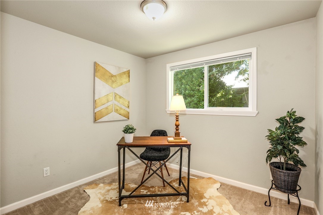 22703 2nd Place West Bothell, WA 98021 - Photo 18 of 23 a work room with furniture and a potted plant