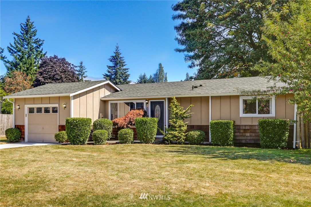 22703 2nd Place West Bothell, WA 98021 - Photo 3 of 23 front view of a house with a yard