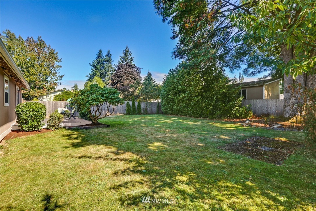 22703 2nd Place West Bothell, WA 98021 - Photo 22 of 23 a view of a backyard with a garden