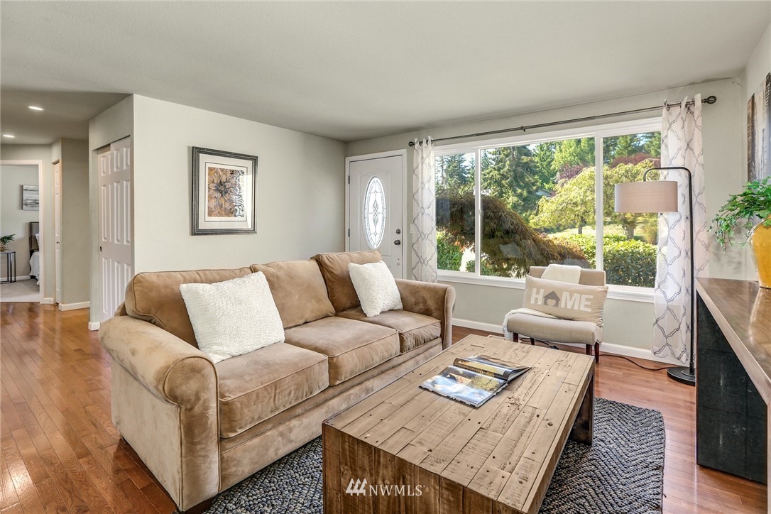22703 2nd Place West Bothell, WA 98021 - Photo 6 of 23 a living room with furniture and a large window