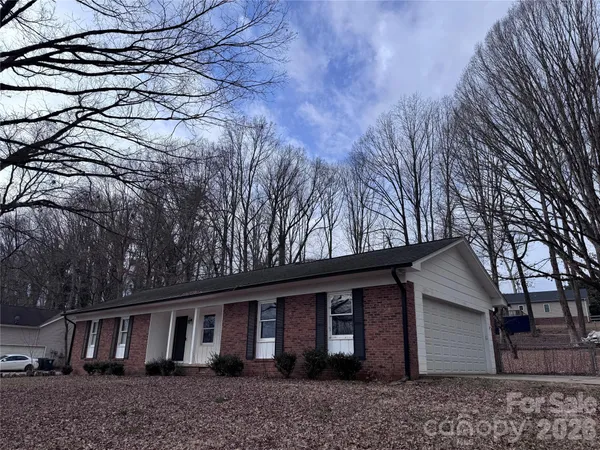 a view of house with a tree