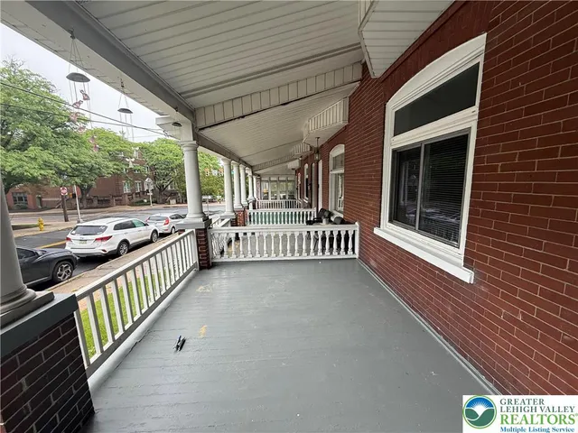 a view of balcony with furniture