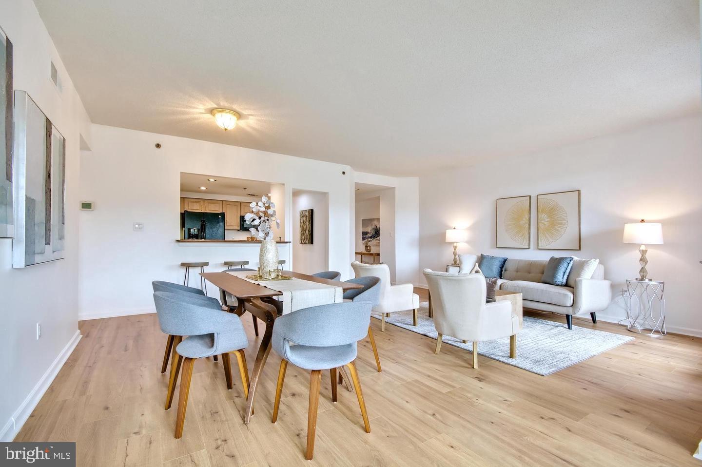 930 Astern Way, Unit 511 Annapolis, MD 21401 - Photo 4 of 27 a view of a dining room with furniture and wooden floor