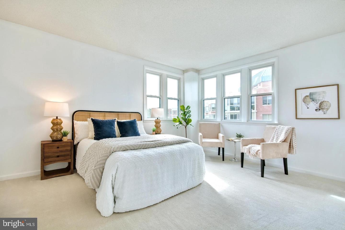 930 Astern Way, Unit 511 Annapolis, MD 21401 - Photo 8 of 27 a spacious bedroom with bed and a large window