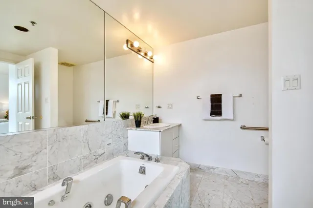a bathroom with a bathtub and a sink