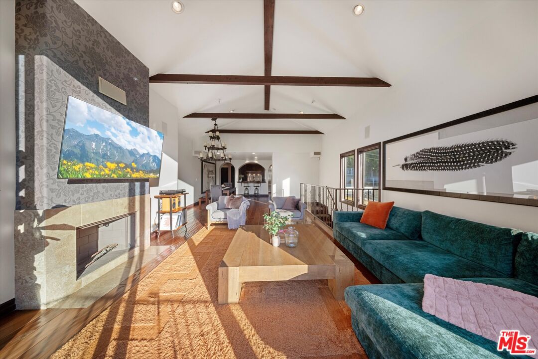 7223 Sycamore Trail Los Angeles, CA 90068 - Photo 13 of 62 a living room with fireplace furniture and a flat screen tv
