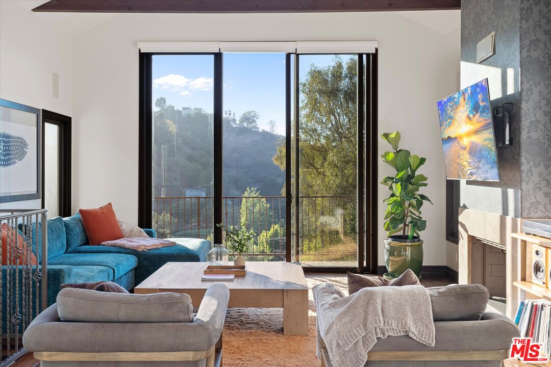 7223 Sycamore Trail Los Angeles, CA 90068 - Photo 15 of 62 a living room with furniture and a large window