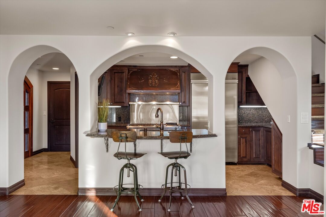 7223 Sycamore Trail Los Angeles, CA 90068 - Photo 17 of 62 a livingroom view with chairs and wooden floor