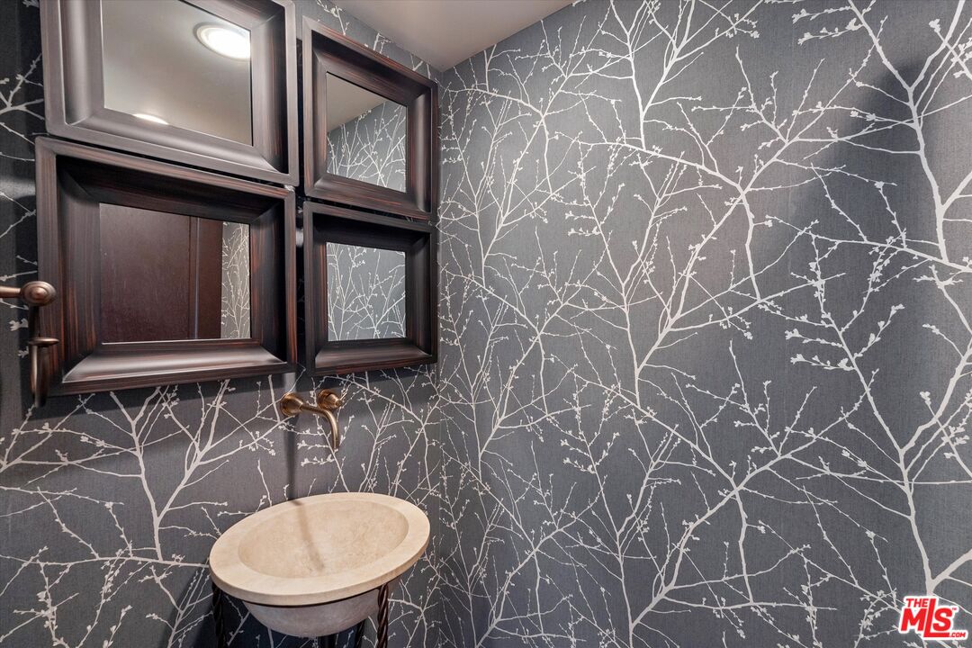 7223 Sycamore Trail Los Angeles, CA 90068 - Photo 20 of 62 a bathroom with a toilet and a sink