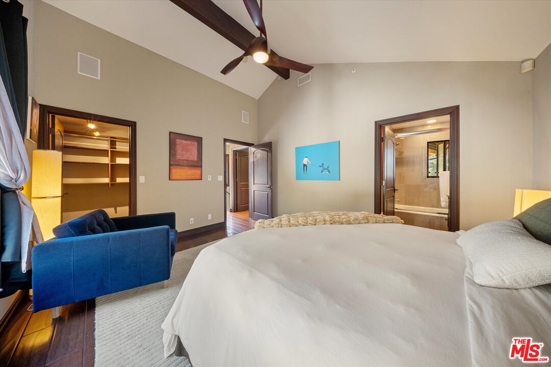 7223 Sycamore Trail Los Angeles, CA 90068 - Photo 22 of 62 a bedroom with a bed couch and a window