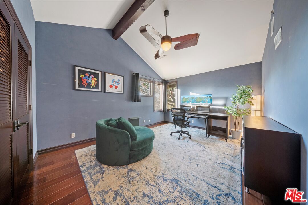7223 Sycamore Trail Los Angeles, CA 90068 - Photo 25 of 62 a living room with furniture and a dining table