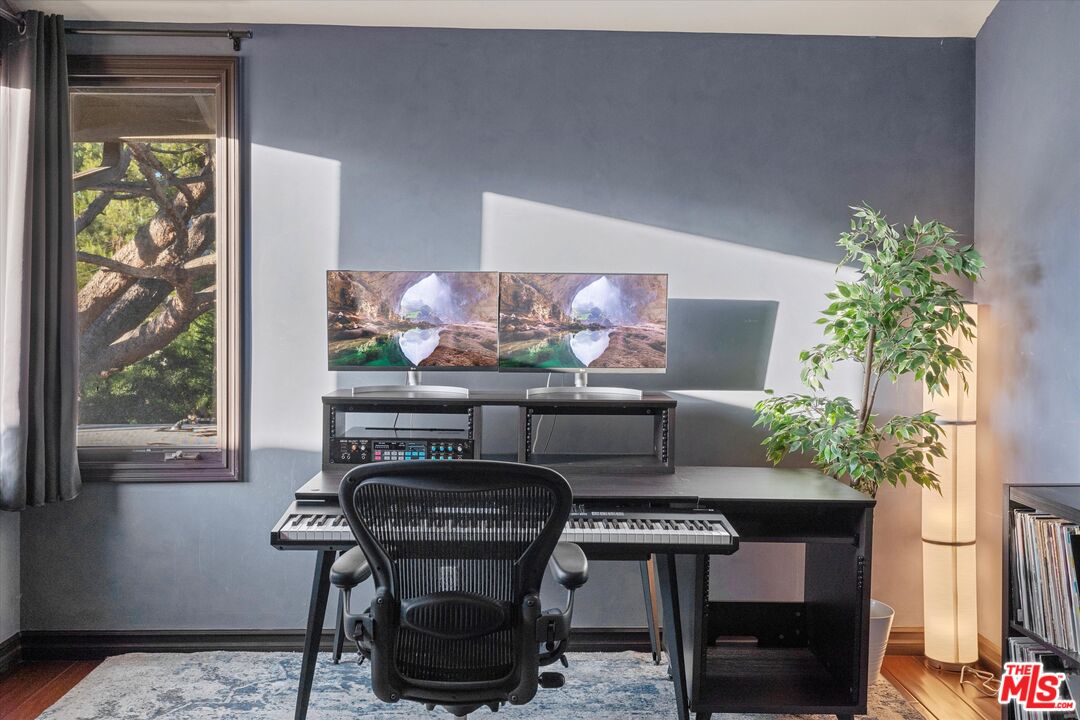 7223 Sycamore Trail Los Angeles, CA 90068 - Photo 27 of 62 a living room with furniture and a potted plant