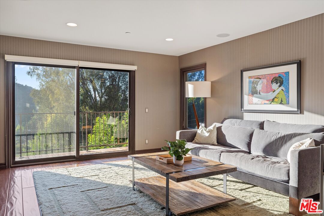7223 Sycamore Trail Los Angeles, CA 90068 - Photo 29 of 62 a living room with furniture and a large window