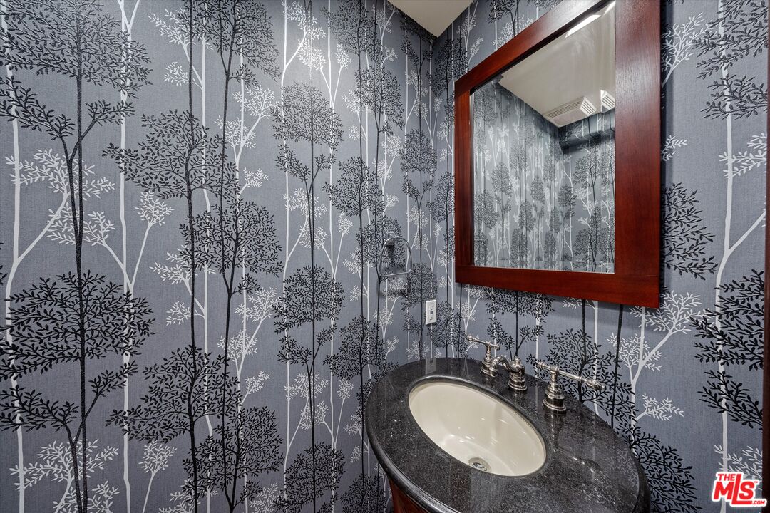 7223 Sycamore Trail Los Angeles, CA 90068 - Photo 35 of 62 a bathroom with a sink toilet and mirror