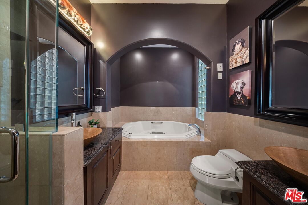 7223 Sycamore Trail Los Angeles, CA 90068 - Photo 41 of 62 a bathroom with a sink and a mirror