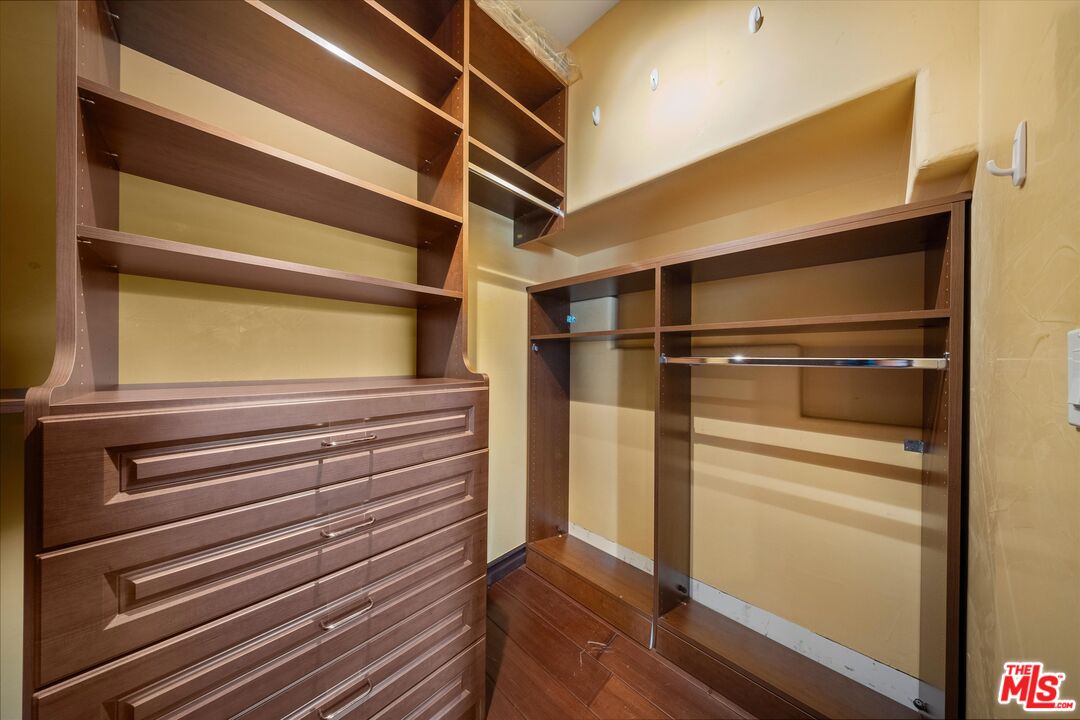 7223 Sycamore Trail Los Angeles, CA 90068 - Photo 48 of 62 a view of walk in closet with empty racks