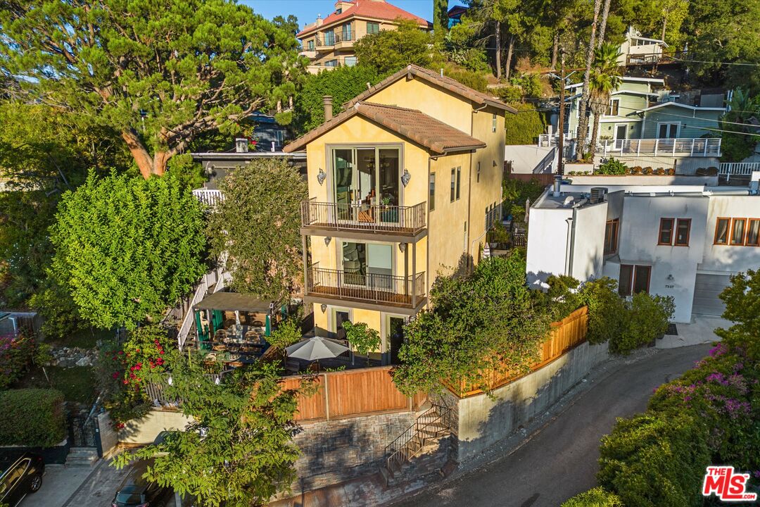 7223 Sycamore Trail Los Angeles, CA 90068 - Photo 5 of 62 a front view of a residential houses with yard