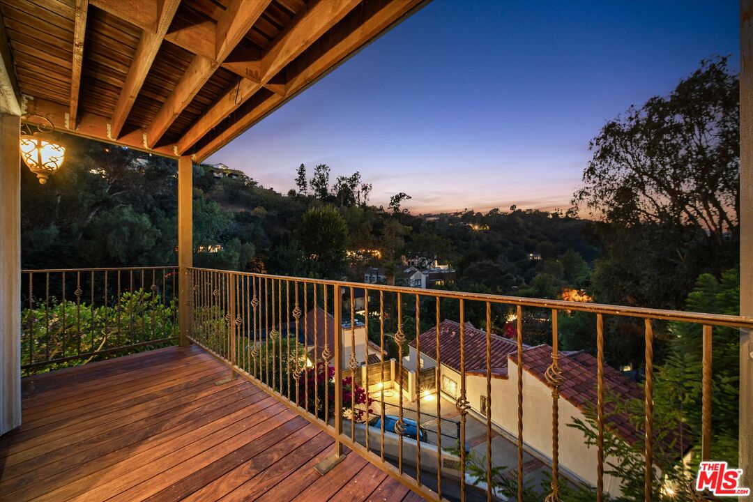 7223 Sycamore Trail Los Angeles, CA 90068 - Photo 7 of 62 a view of balcony with wooden floor and fence