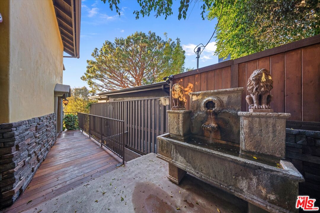 7223 Sycamore Trail Los Angeles, CA 90068 - Photo 9 of 62 a view of a small house with wooden fence