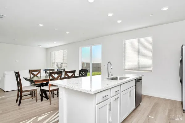 a kitchen with center island and windows