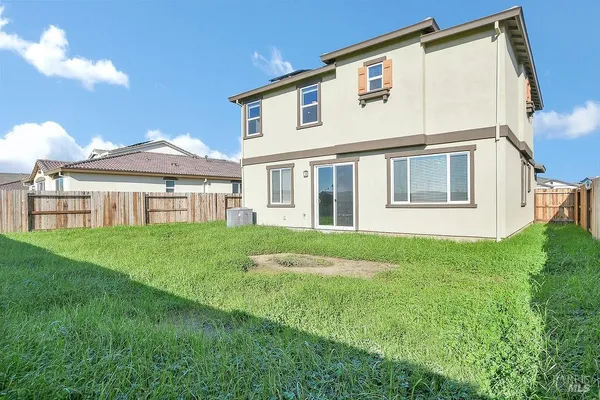 a view of an house with backyard porch and garden