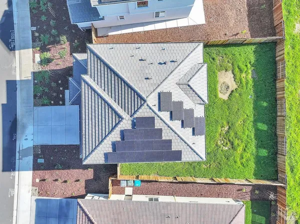 a view of a house with a street