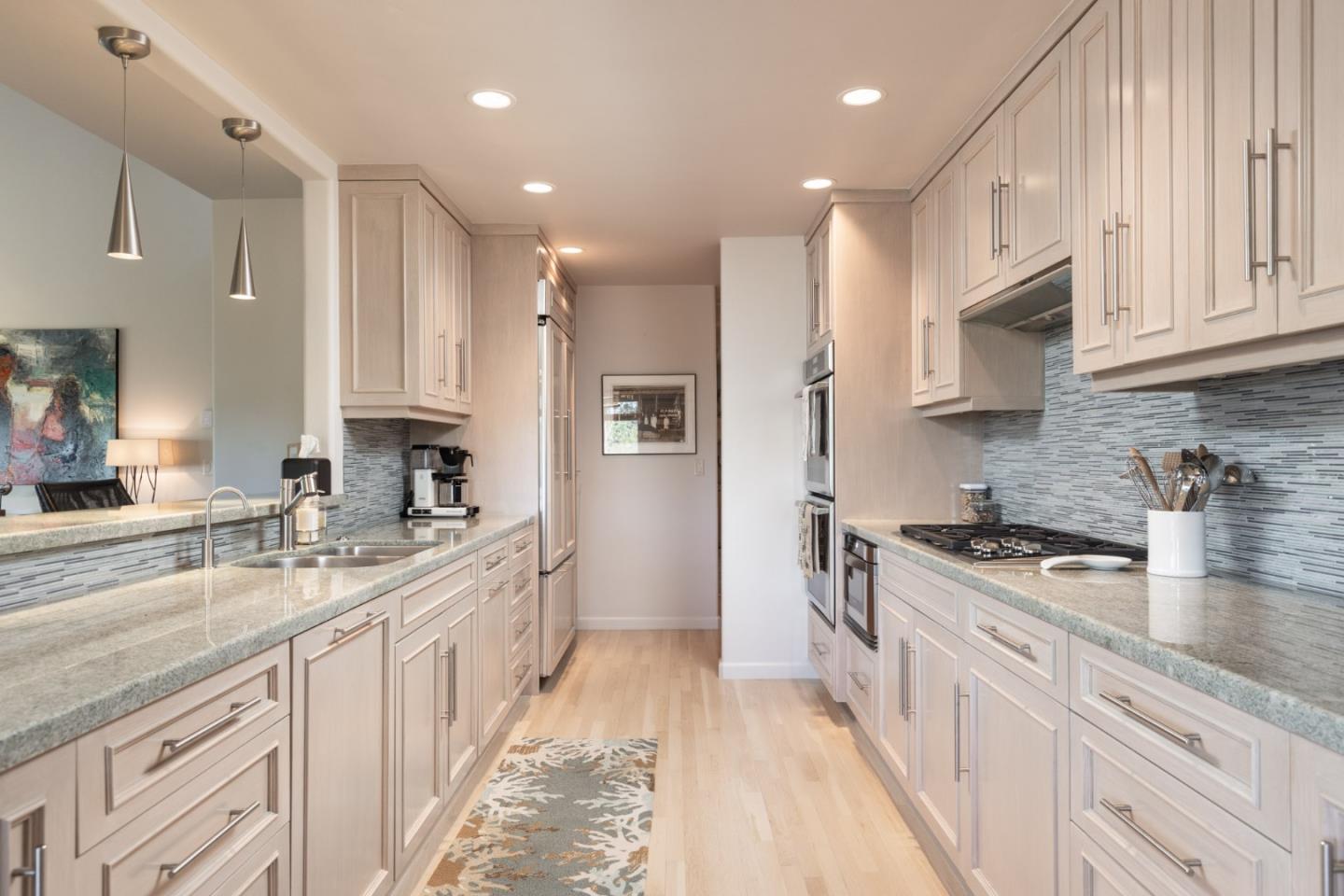 38 Shepherds Knoll Road Monterey, CA 93940 - Photo 11 of 22 a large kitchen with stainless steel appliances granite countertop a lot of counter space and wooden floors
