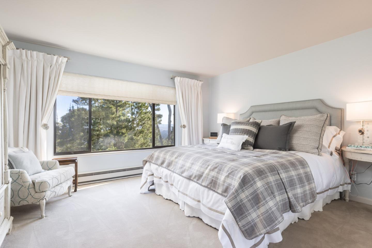 38 Shepherds Knoll Road Monterey, CA 93940 - Photo 13 of 22 a bedroom with a bed and a large window