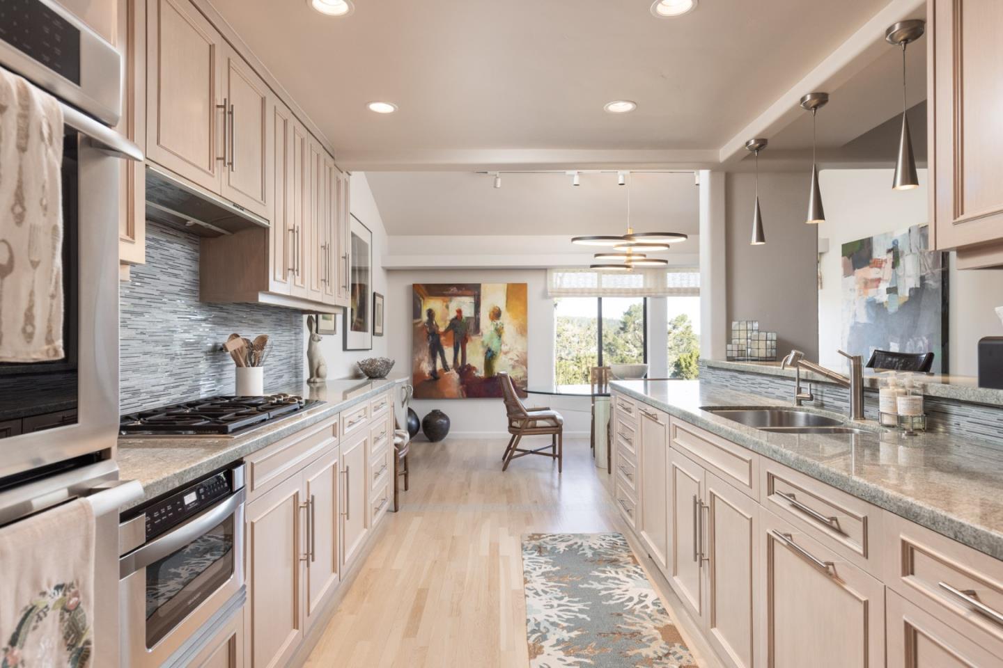 38 Shepherds Knoll Road Monterey, CA 93940 - Photo 10 of 22 a large kitchen with stainless steel appliances granite countertop a lot of counter space and wooden floors