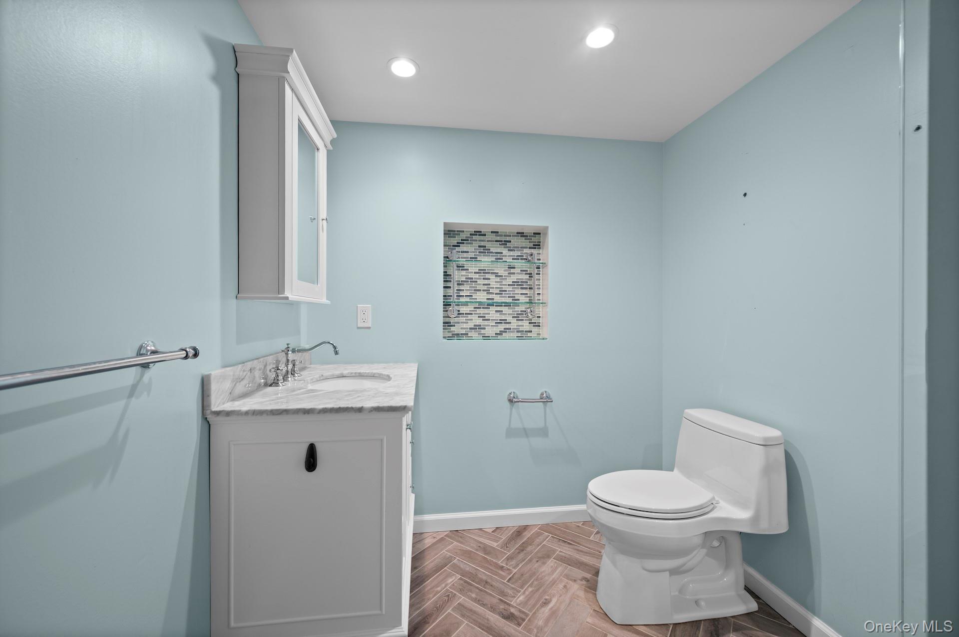 82 Shingle House Road Millwood, NY 10546 - Photo 26 of 50 a bathroom with a toilet sink and mirror