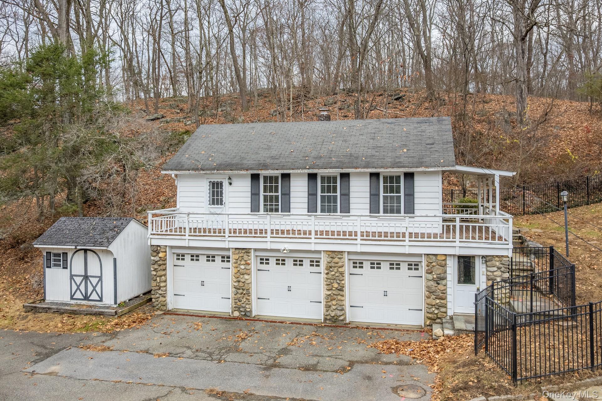82 Shingle House Road Millwood, NY 10546 - Photo 28 of 50 a front view of a house with a garden